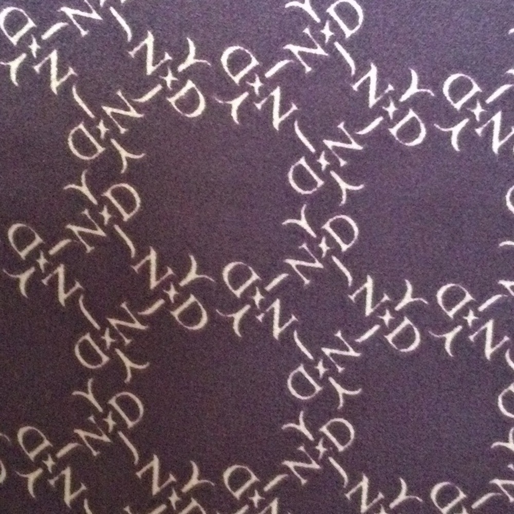 Scarf 100% Silk Do not know the designer. Size 42” by 16 1/2” color Purple #343